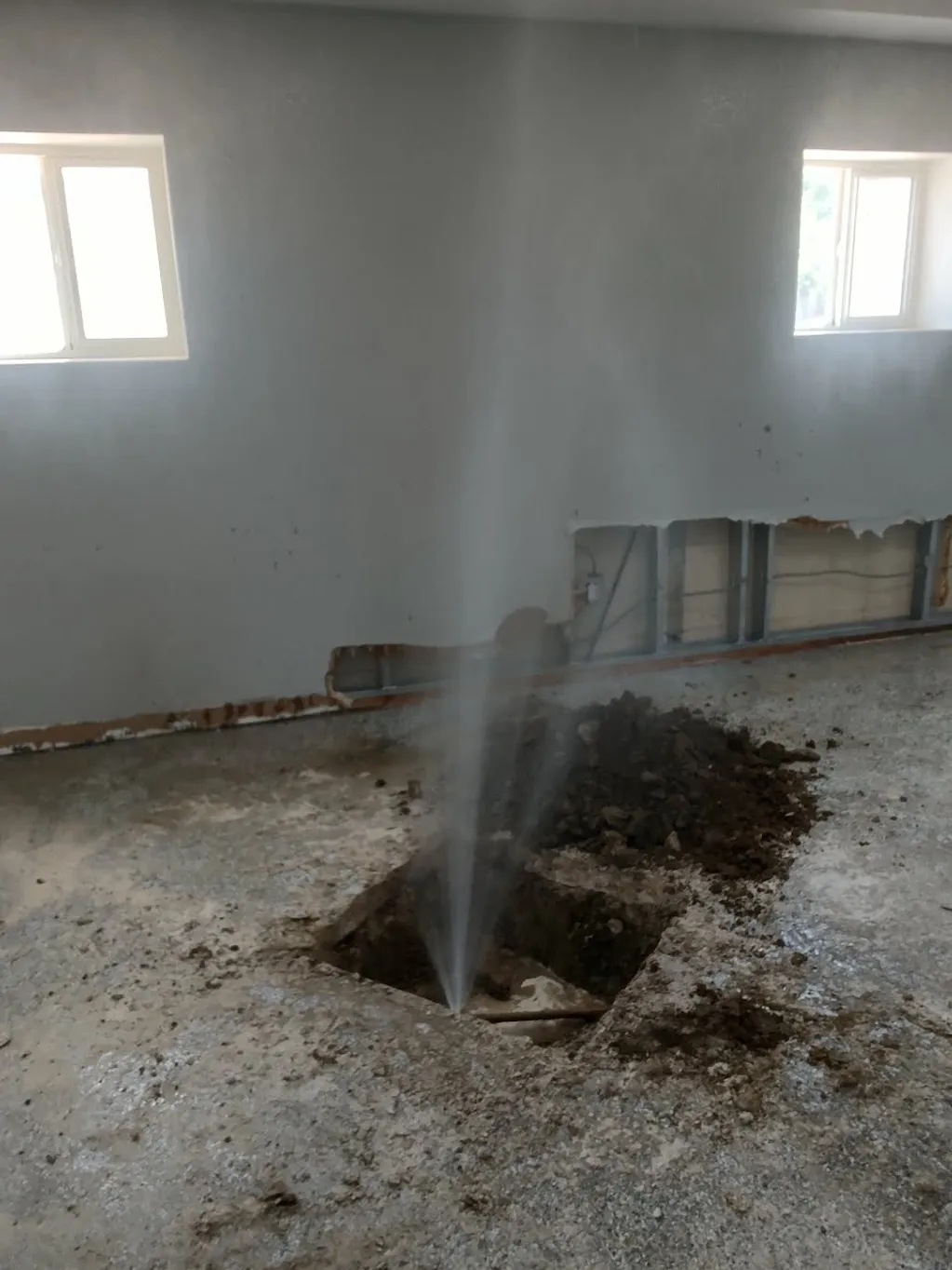 slab leak spraying out of the ground